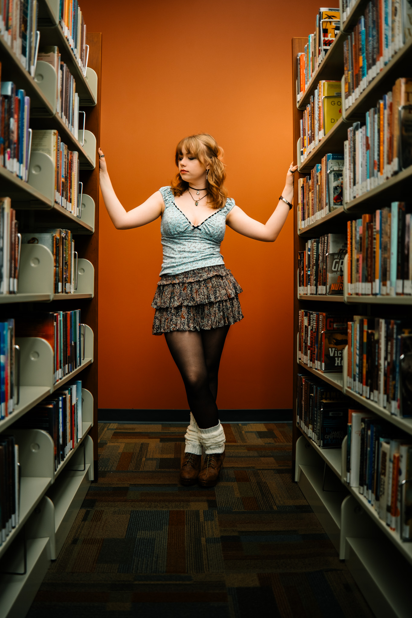 Editorial portrait in library by Louisiana visual artist